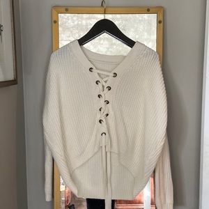 Haute Rogue tie sweater. One size fits most but fits closer to a size S.